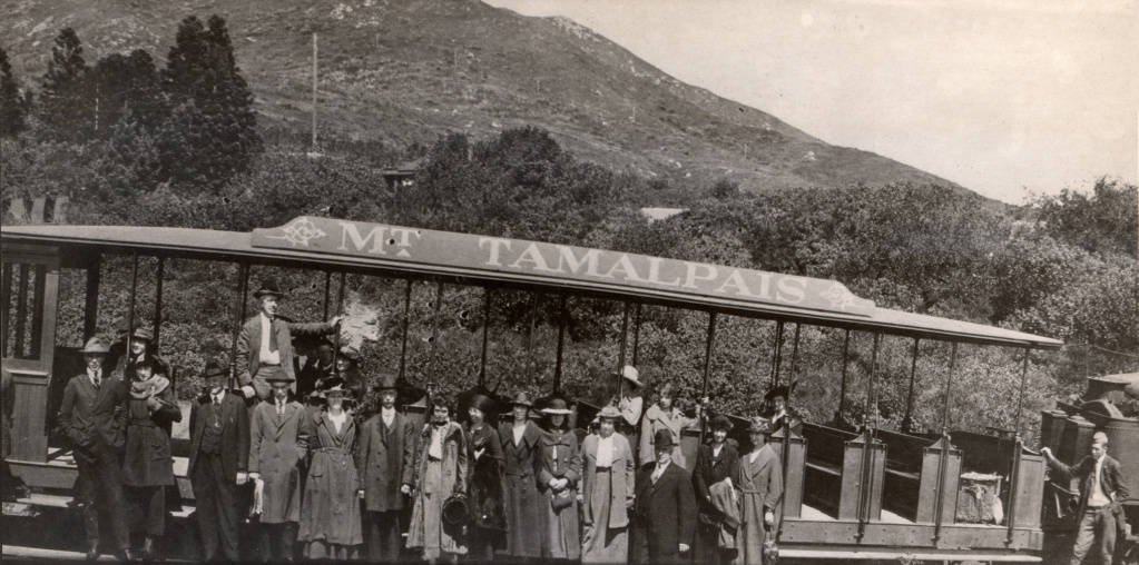 Passengers lined up beside an open Mt. Tamalpais railway car at West Point