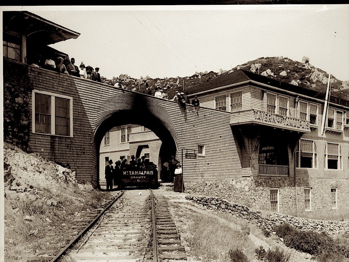 A loaded gravity car under the arched bridge at the Tavern
